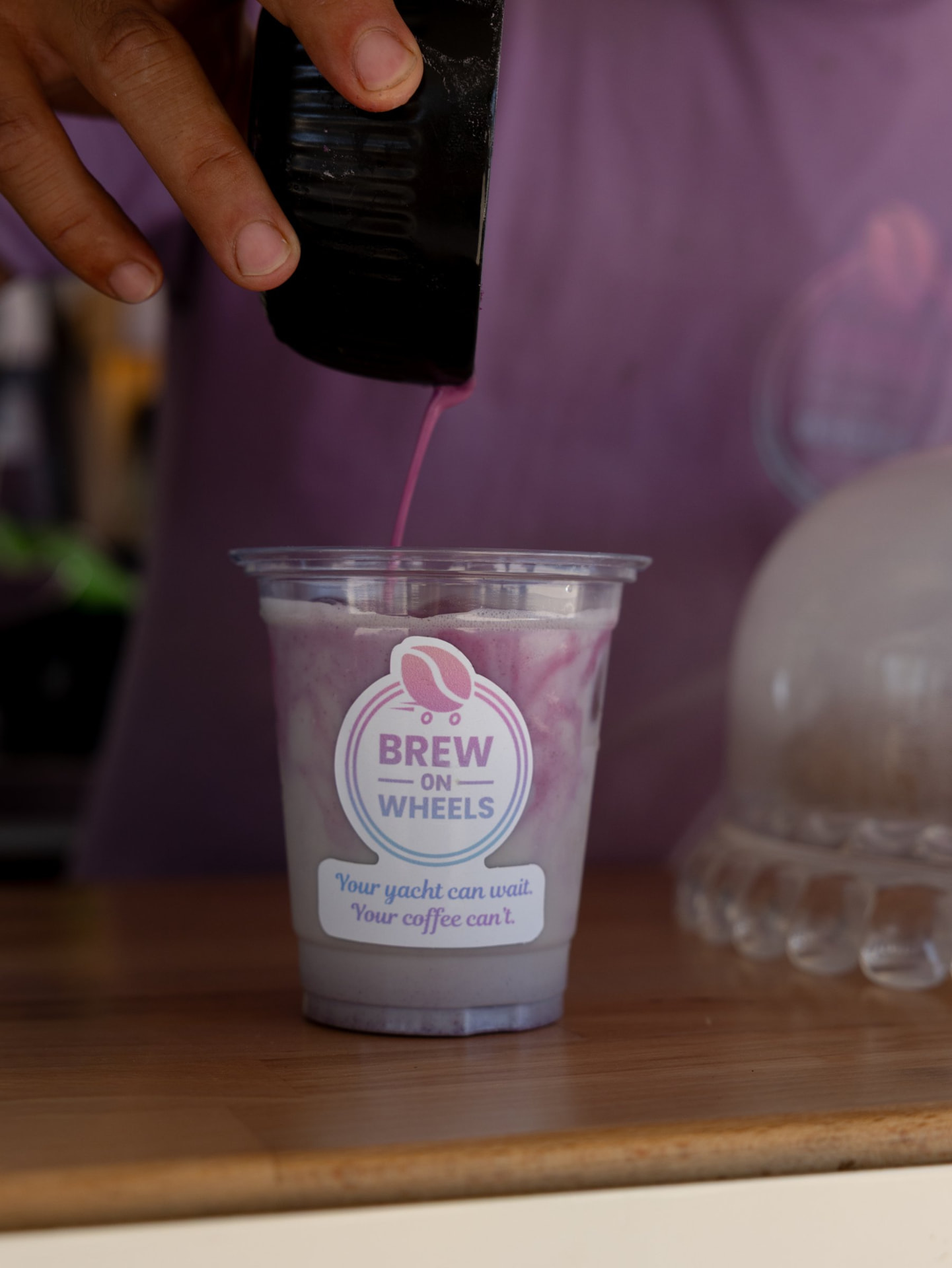 Barista finishing a signature iced drink at a Riviera event